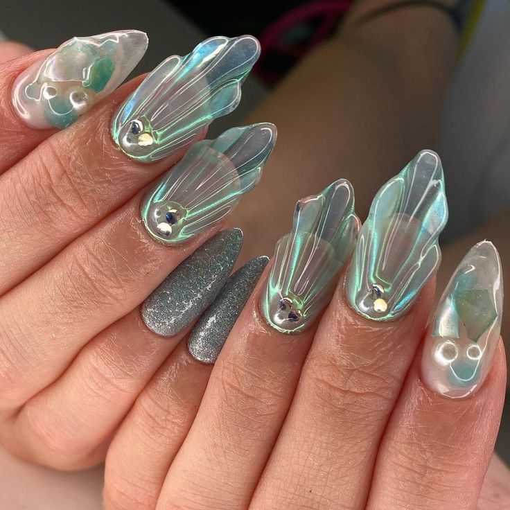 Elegant Petal-Inspired Nail Design with Translucent Tips and Shimmering Gemstones.