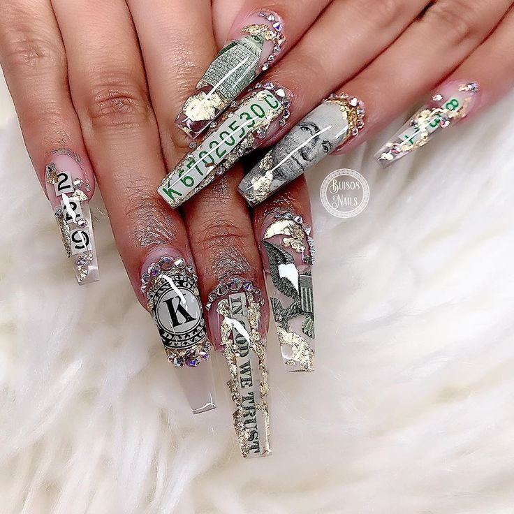 Luxurious Money-Themed Acrylic Nail Design with Rhinestones and Glossy Finish.