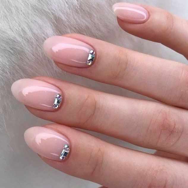 Sophisticated Soft Pink Gradient Nail Design with Glossy Finish and Sparkling Rhinestones.