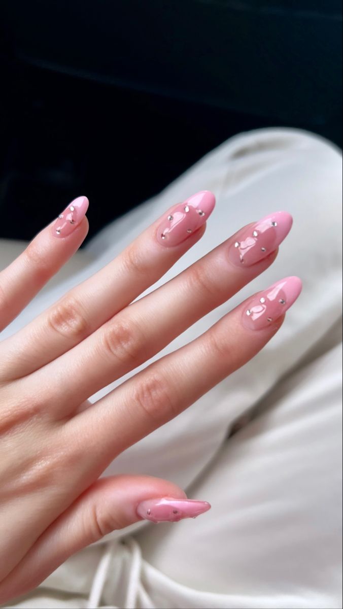 Chic Almond-Shaped Nails: Elegant Soft Pink with Glamorous Sparkling Embellishments