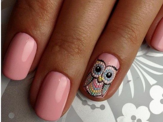 Charming Whimsical Owl Nail Design on Pale Pink Background