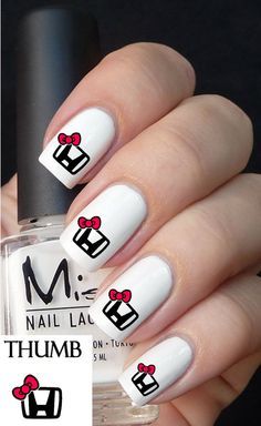 Playful Cartoon Gift Nail Art: Festive Design with Bold Accents on Clean White Base.