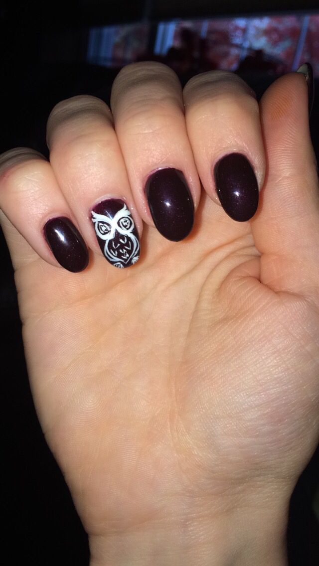 Sophisticated Dark Burgundy Nail Design with Whimsical Owl Accent.