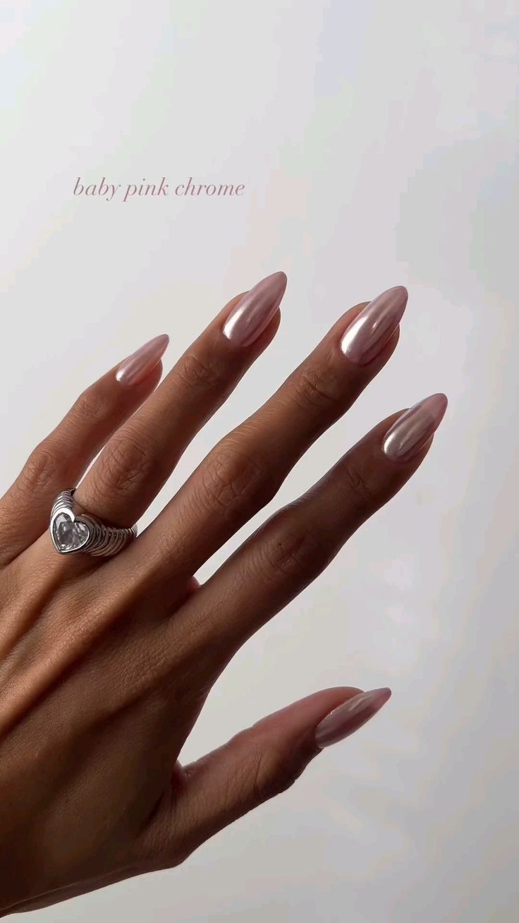 Chic Almond-Shaped Baby Pink Chrome Nails: Elegance Meets Glam.