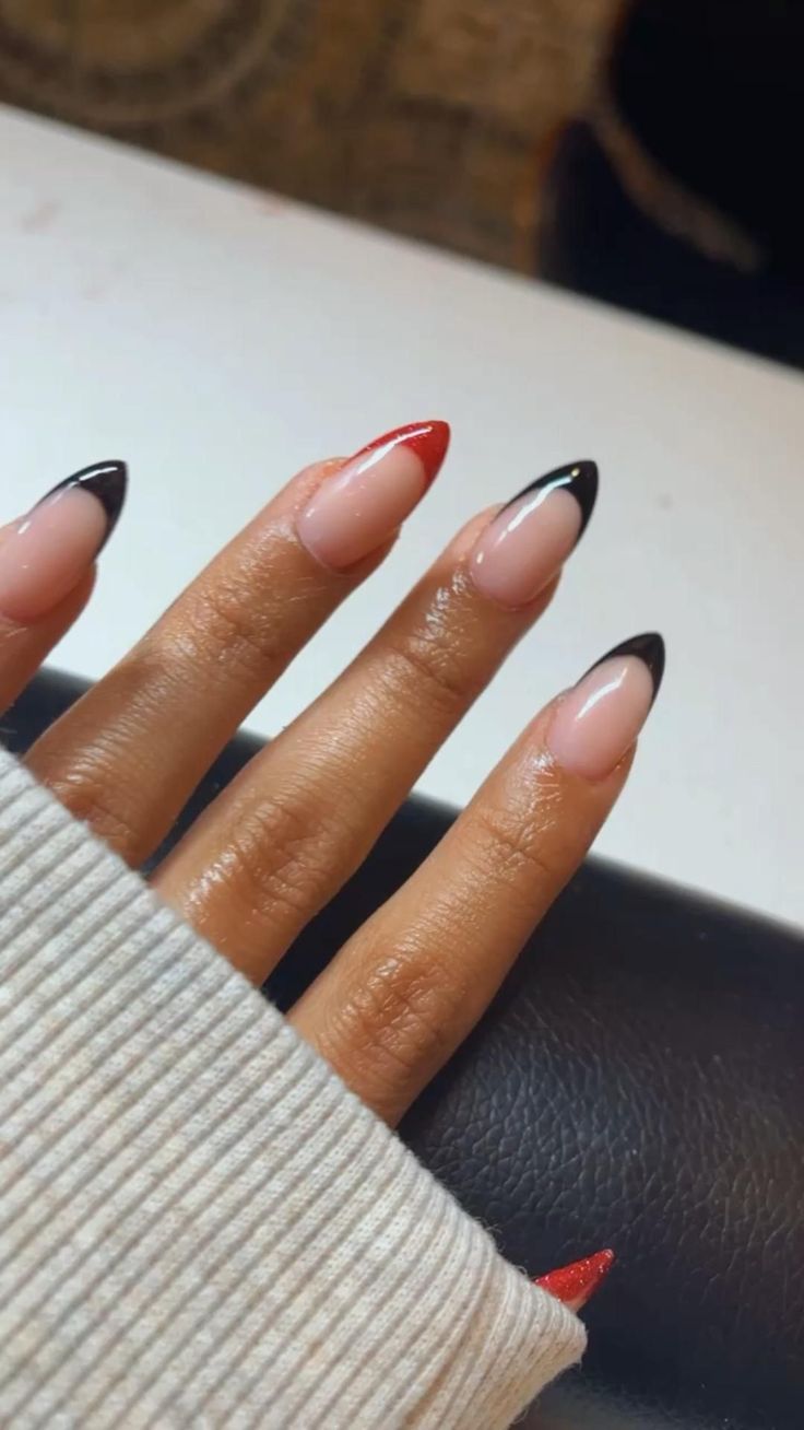 Chic Nail Design: Elegant Nude with Bold Red and Black Accents