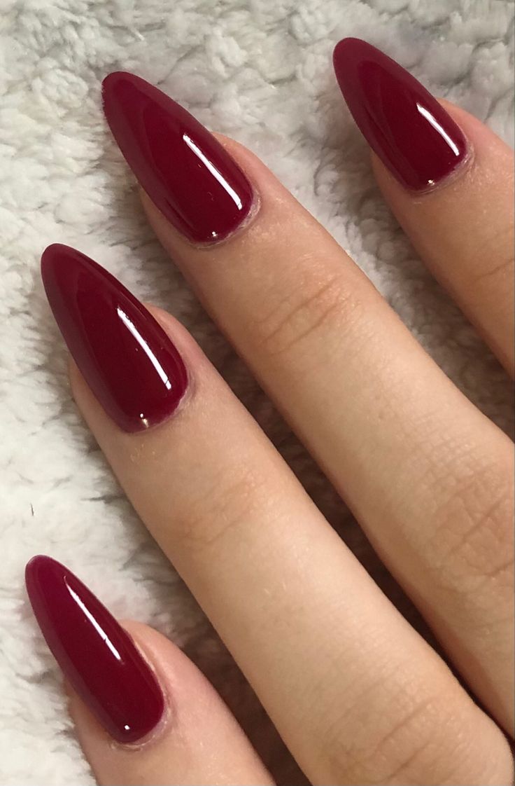 Elegant Crimson Almond-Shaped Nails for Chic Occasions.