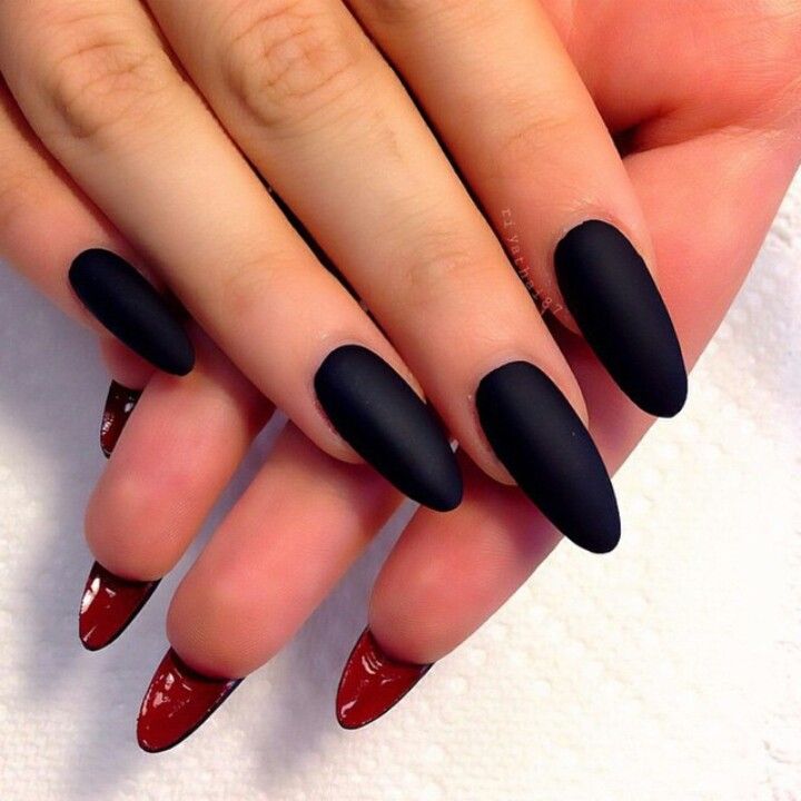 Sleek Matte Black and Glossy Red Almond Nail Design for Elegant Sophistication.