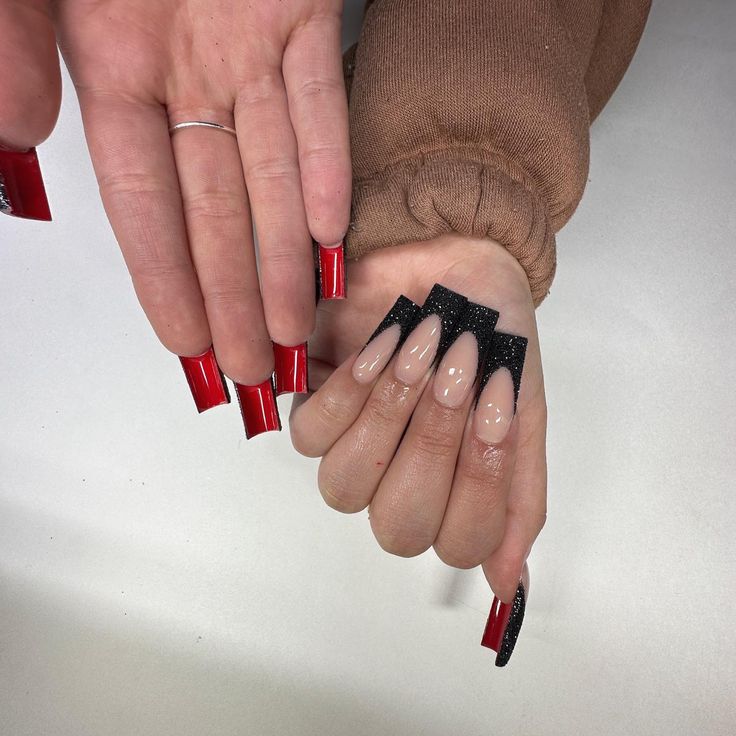 Bold Dual Nail Design: Glossy Red and Chic Nude-Black Glitter Tips Showcase Modern Versatility.