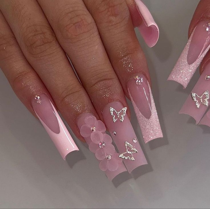 Elegant Pink Nail Design with Butterfly Accents and Floral Embellishments