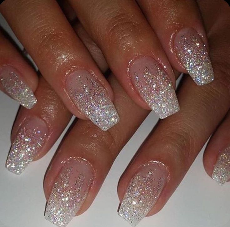 Glamorous Sparkling Ombre Nails: A Dreamy Blend of Soft Pink and Shimmering Silver.