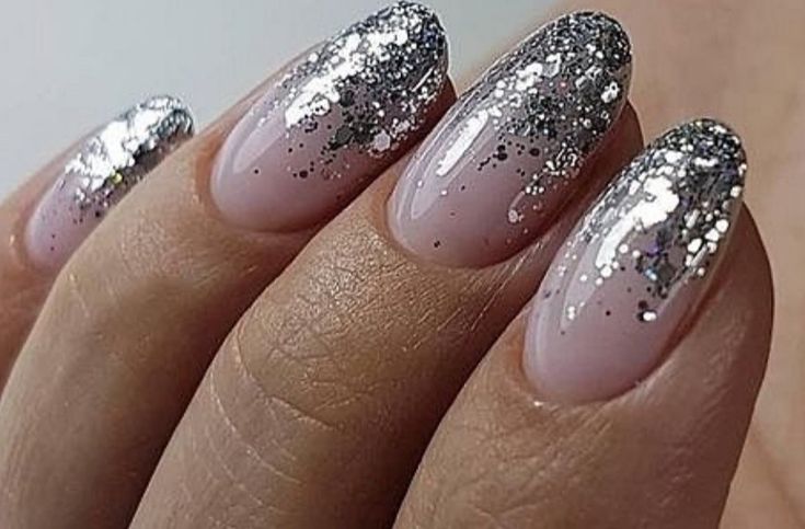 Chic Glittering Ombre Nail Design: Soft Pink Base to Shimmering Silver Tips.