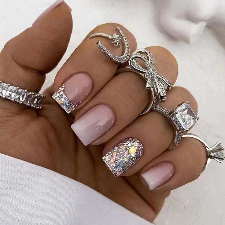 Glamorous Nail Design: Glossy Nude Base with Multicolored Glitter Accent