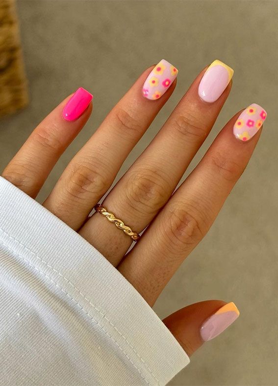 Playful Floral Nail Design with Bright Colors for a Cheerful Summer Vibe