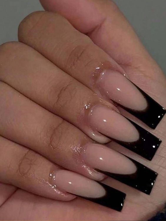 Chic Nude Nails with Bold Black Tips: A Stylish and Modern Design