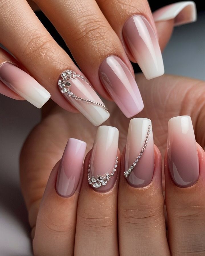 Chic Ombre Nail Design with Soft Pink and White Gradient, Embellished with Sparkling Rhinestones.