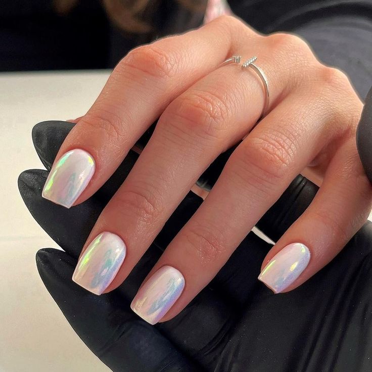 Captivating Iridescent Nail Design with Glossy Finish and Elegant Square Shapes.