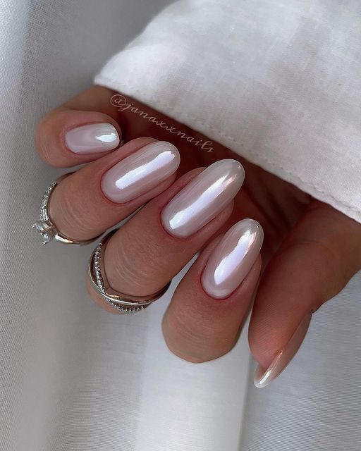 Chic Pearlescent Nail Design: Timeless Elegance with Delicate Accents.