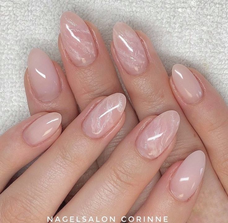 Sophisticated Almond-Shaped Nail Design in Soft Nude with Glossy and Matte Finishes.