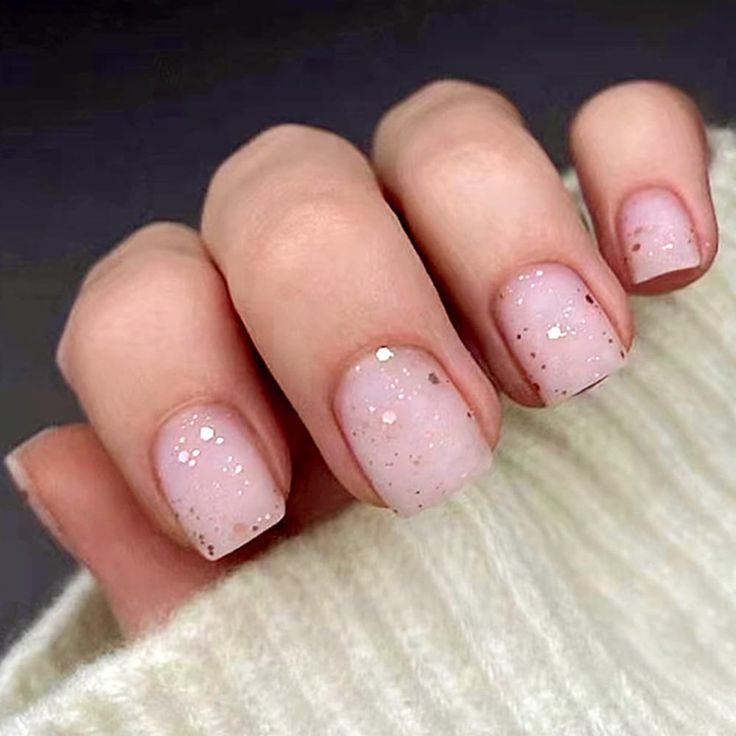 Sophisticated Soft Pink Nail Design with Glitter Gradient Accents.