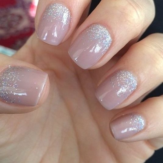 Elegant Shimmering Nude Manicure with Glitter Gradient Accents