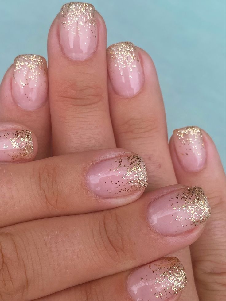 Chic Nude Nail Design with Glamorous Gold Glitter Tips for Special Occasions