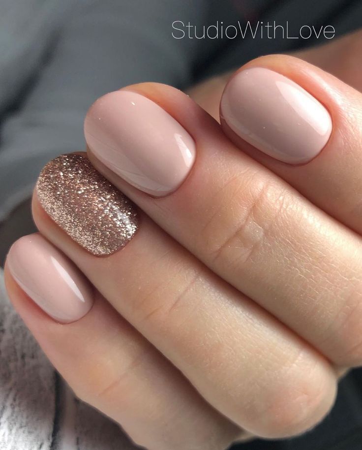 Chic Nude Nail Design with Glamorous Gold Glitter Accent