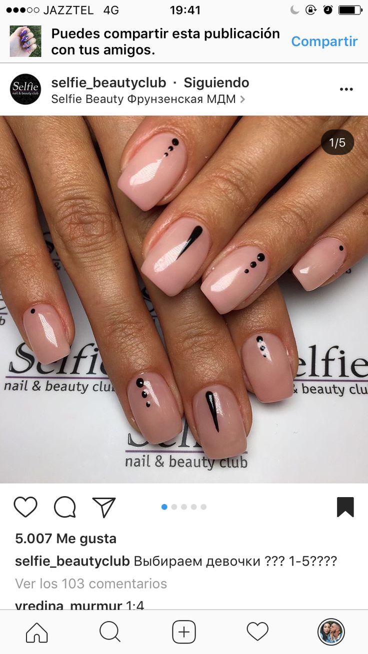 Chic Pastel Pink Nail Design with Subtle Black Accents for Any Occasion.