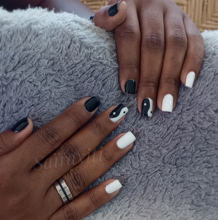 Chic Black and White Nail Design with Abstract Patterns for Unique Expression.