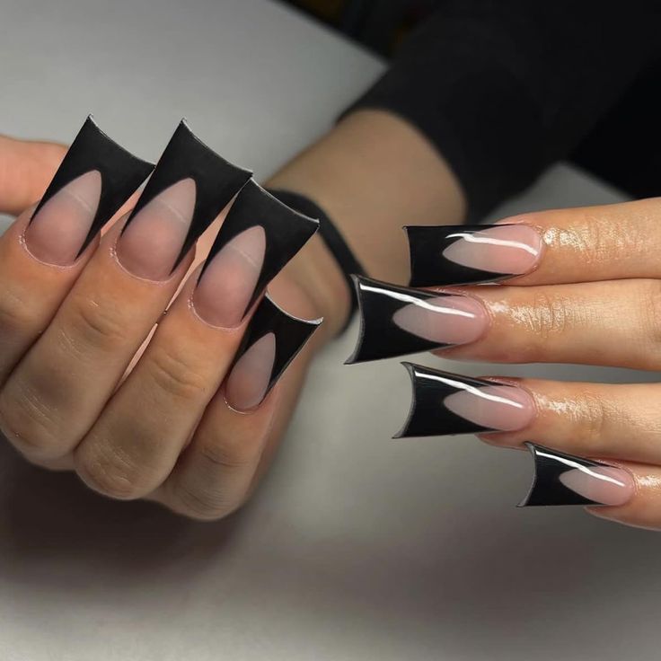 Edgy Nail Design with Bold Black Tips and Geometric Negative Space Accents.