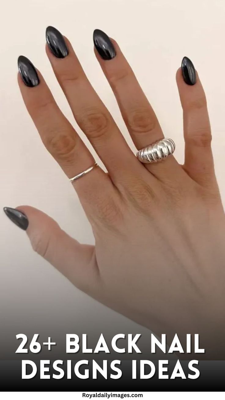 Chic Black Almond Nails: A Sophisticated Look with Glossy Finish and Minimalist Silver Rings.