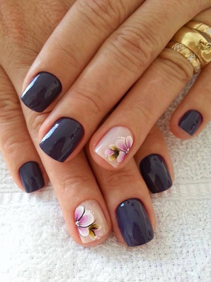 Stunning Navy and Nude Nail Design with Floral Accents.