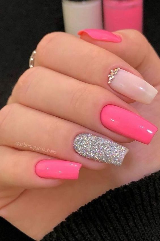 Chic Colorful Nail Design: Vibrant Pink and Sparkling Silver with Rhinestone Accent