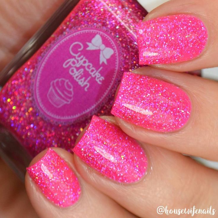 Vibrant Pink Glitter Nails: Playful and Eye-Catching Nail Art for Festive Occasions.