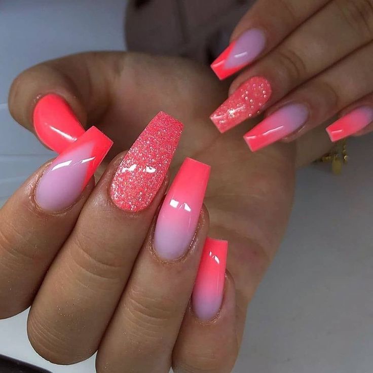 Playful Vibrant Nail Design: Bright Pink Ombre with Glitter Accents