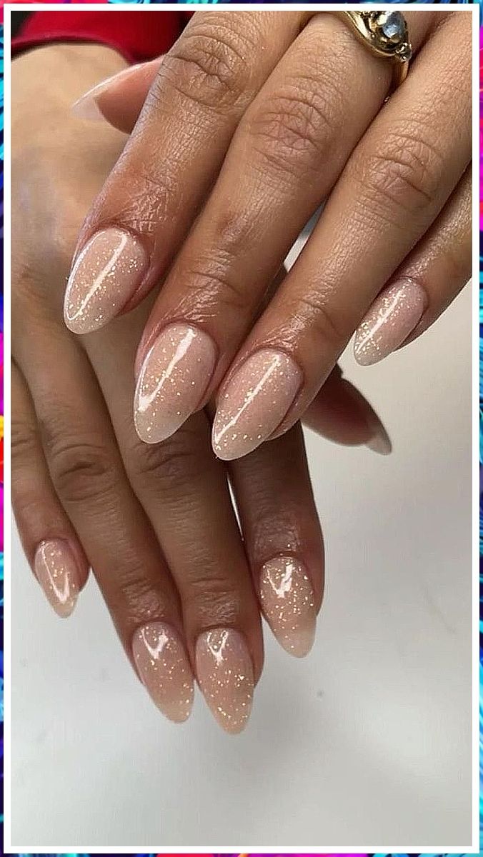 Chic Almond-shaped Nails: Elegant Nude Design with Subtle Sparkles