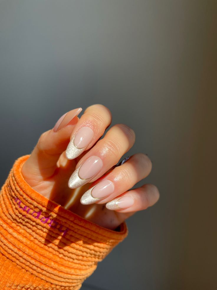 Chic Almond-Shaped French Manicure: Soft Nude Base with Shimmering Silver Tips