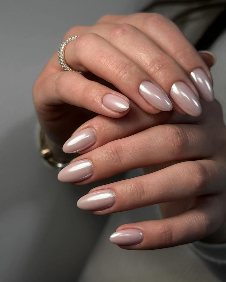 Chic Almond-Shaped Nude Nails with Elegant Sheen and Timeless Charm