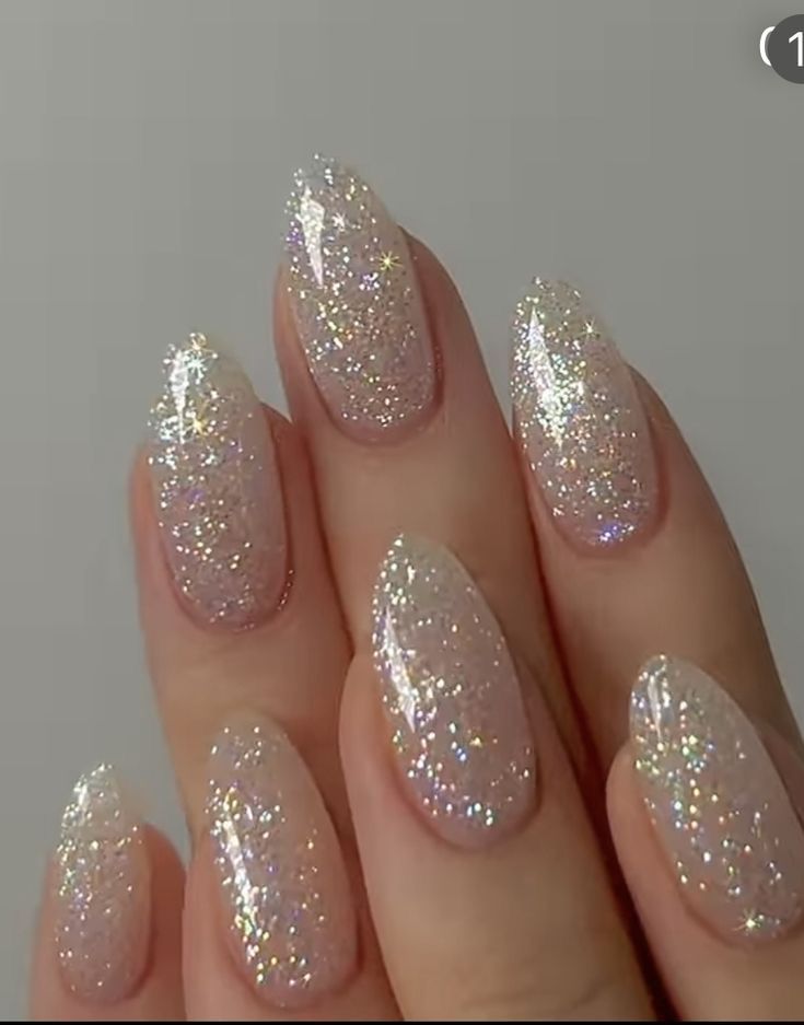 Elegant Soft Pink and Glitter Nail Design for Glamorous Occasions.