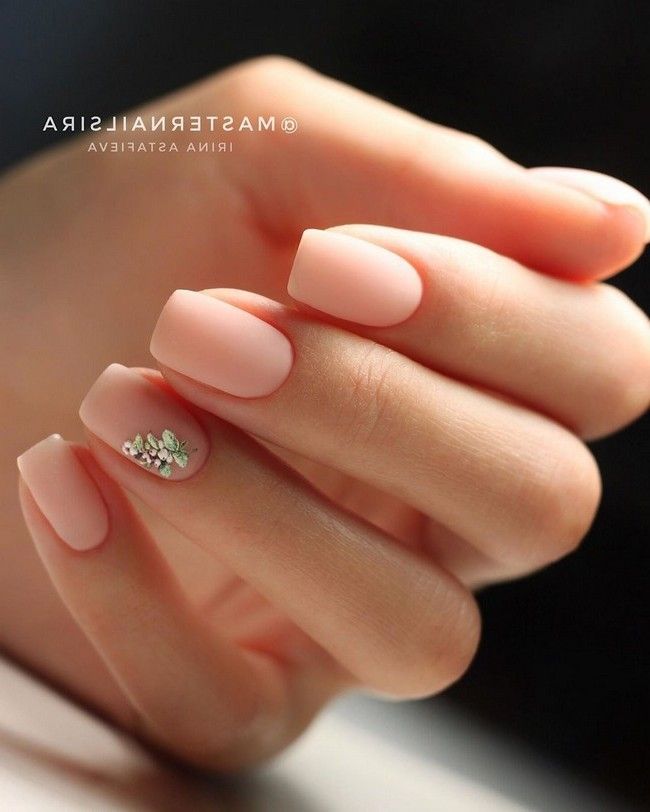 Elegant Nude Nails with Subtle Design and Glamorous Accent.