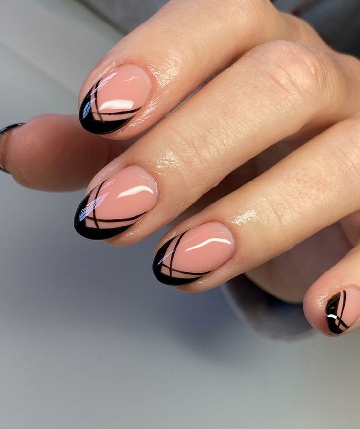 Chic Soft Pink and Black Striped Nail Design: A Modern Elegant Statement.