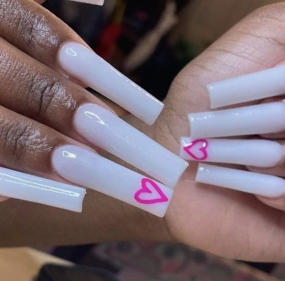 Chic Almond-Shaped Nails with Whimsical Pink Heart Accents.