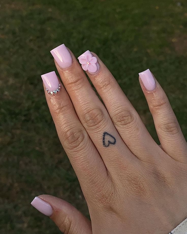 Charming Pastel Pink Nails with Elegant Embellishments Perfect for Any Occasion