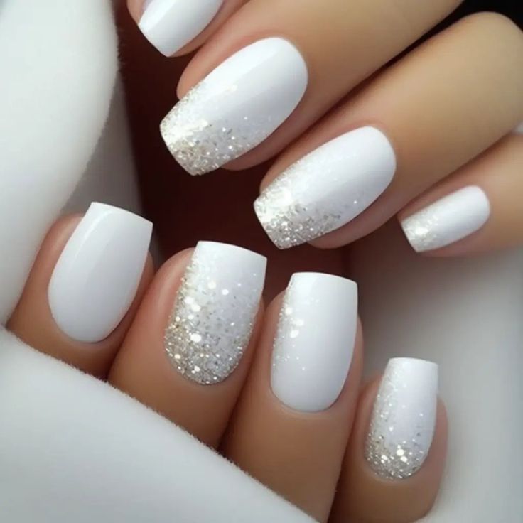 Sophisticated White Base with Glittery Gold Ombre Nail Design.