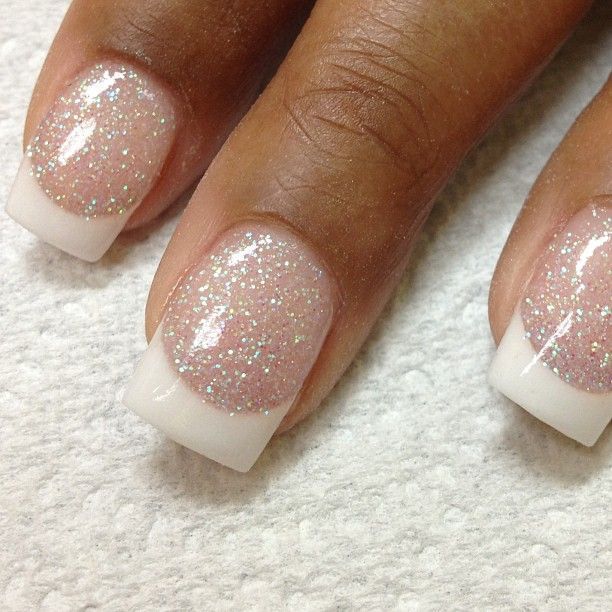 Sparkly Nude French Manicure: Elegant Glam with Subtle Shimmer.