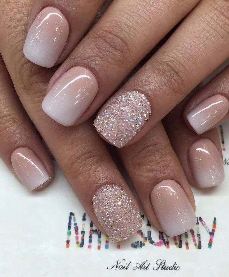 Sophisticated Ombre Nail Design with Textured Accent and Rhinestones.