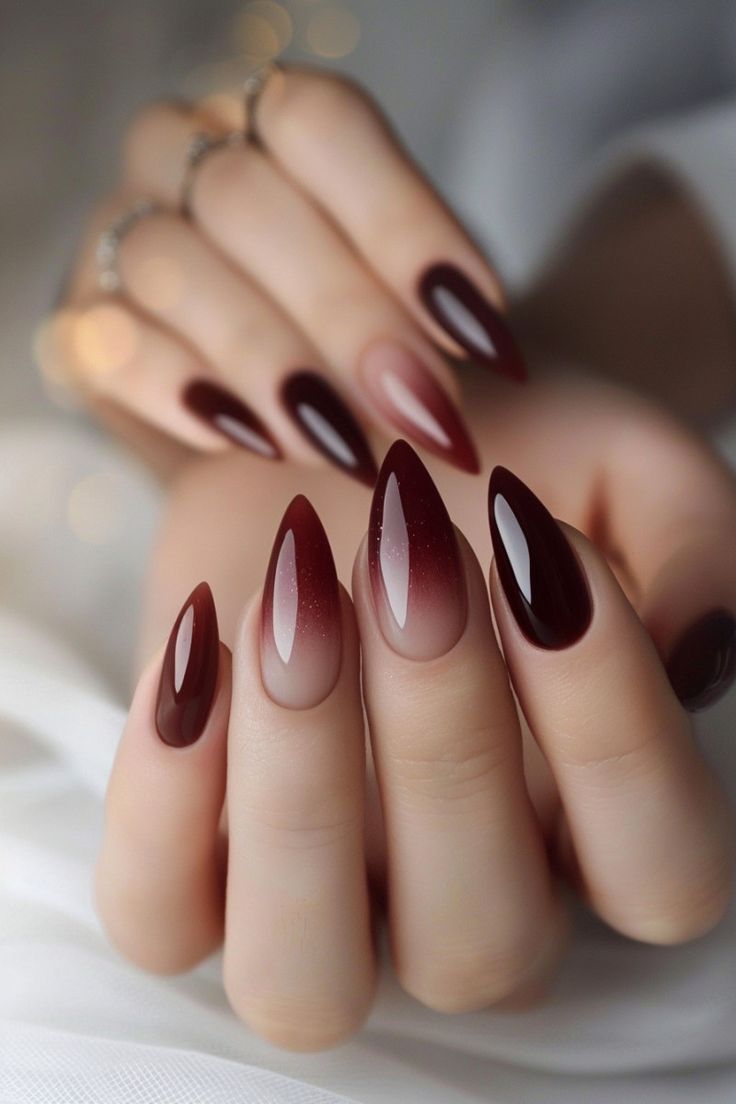 Sophisticated Stiletto Nail Design with Deep Burgundy and Ombre Elegance.