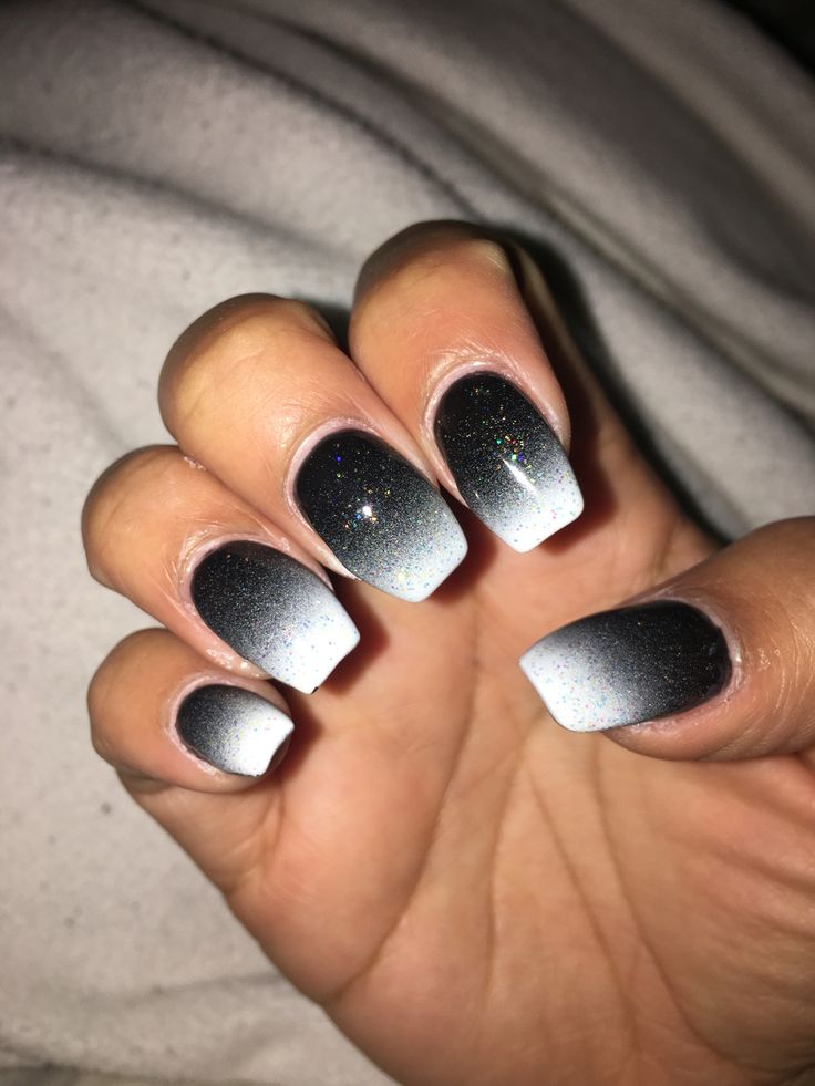 Striking Silver to Black Ombre Nails with Sparkling Accents for a Modern Touch