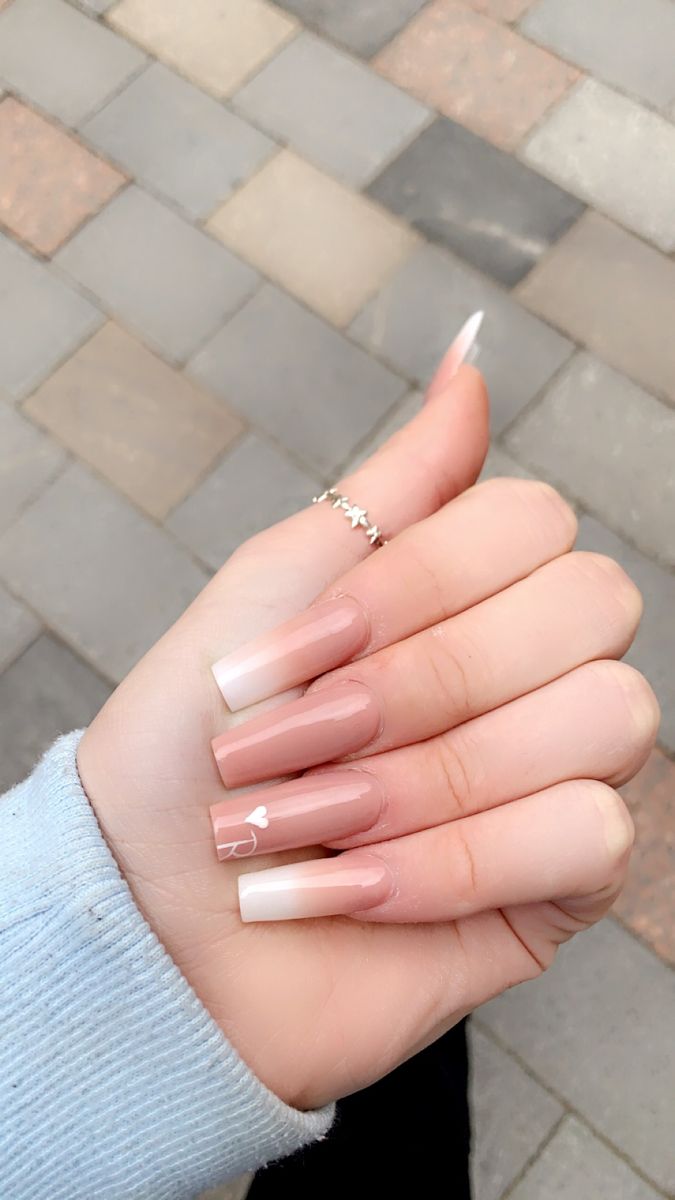 Chic Ombre Nude Nails with Heart Accents for Any Occasion