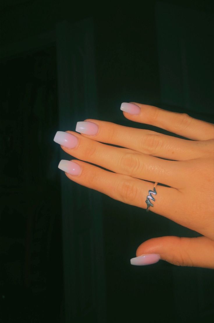 Trendy Ombre Nail Design in Soft Pink and White with Glossy Finish and Minimalist Ring.