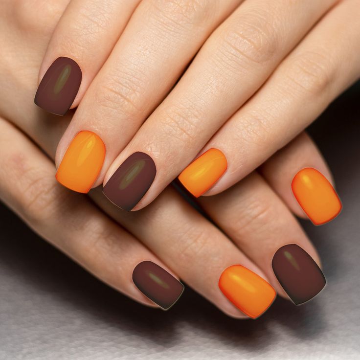 Bold Autumn Nail Design with Glossy and Matte Warm Brown and Bright Orange Shades.